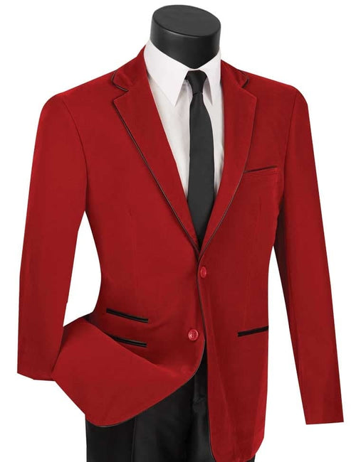 Red tailored suit with single-button closure, notched lapels, and black piping. Worn with a black tie. Smooth, structured fabric.
