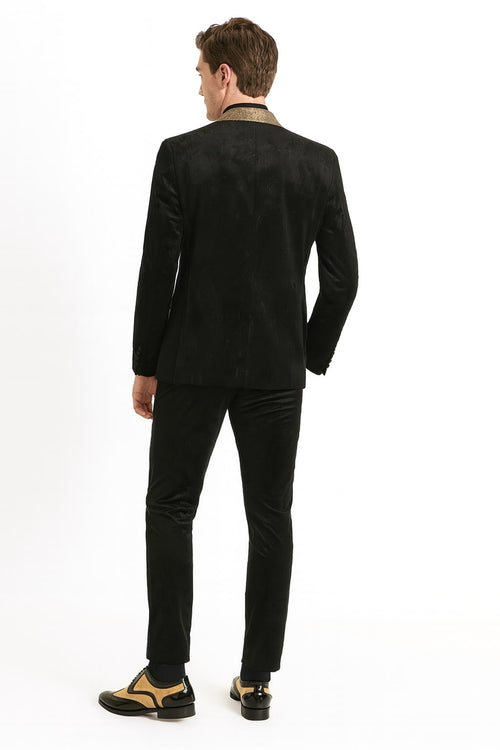 Men's black jacquard tuxedo blazer with gold shawl collar. Features a subtle pattern, structured shape, slim fit, and contrasting gold collar.
