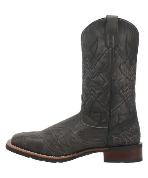 Laredo Axel men's black leather boot. Tall shaft, pointed toe, stacked heel. Textured surface, geometric stitching, pull tab. Light-colored sole.
