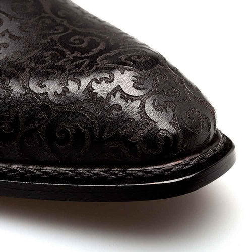 Lontani black & burgundy patina brogue derby shoes. Pointed toe, intricate embossed black leather design. Smooth burgundy accents integrated into upper. Sleek black sole. Classic derby shape.
