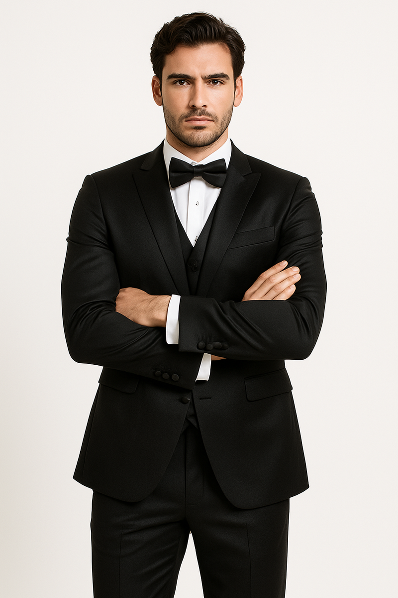 Black Majesty tuxedo set: fitted black blazer with satin lapels, white shirt, black bow tie, tailored black trousers. Smooth, formal fabric.
