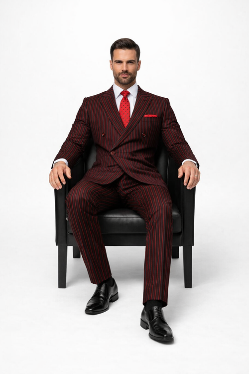 Black and red pinstripe double-breasted suit with a tailored fit, featuring a notched lapel, two rows of buttons, and matching pinstripe trousers. The suit is paired with a white dress shirt and a red polka dot tie.