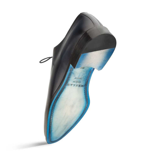 Mezlan's Enterprise dress shoes: sleek blue calfskin upper, streamlined design. Features a contrasting blue leather sole with rounded shape and slight heel. Plain toe.

