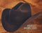 Black Tejana cowboy hat. 4X felt. High crown, slightly curved brim. Smooth, uniform surface. Classic Western style.