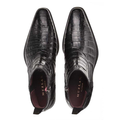 Mezlan Blackmore boot in glossy black crocodile leather. Pointed toe, embossed pattern, side zip closure, and subtle heel.
