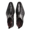 Mezlan Blackmore boot in glossy black crocodile leather. Pointed toe, embossed pattern, side zip closure, and subtle heel.
