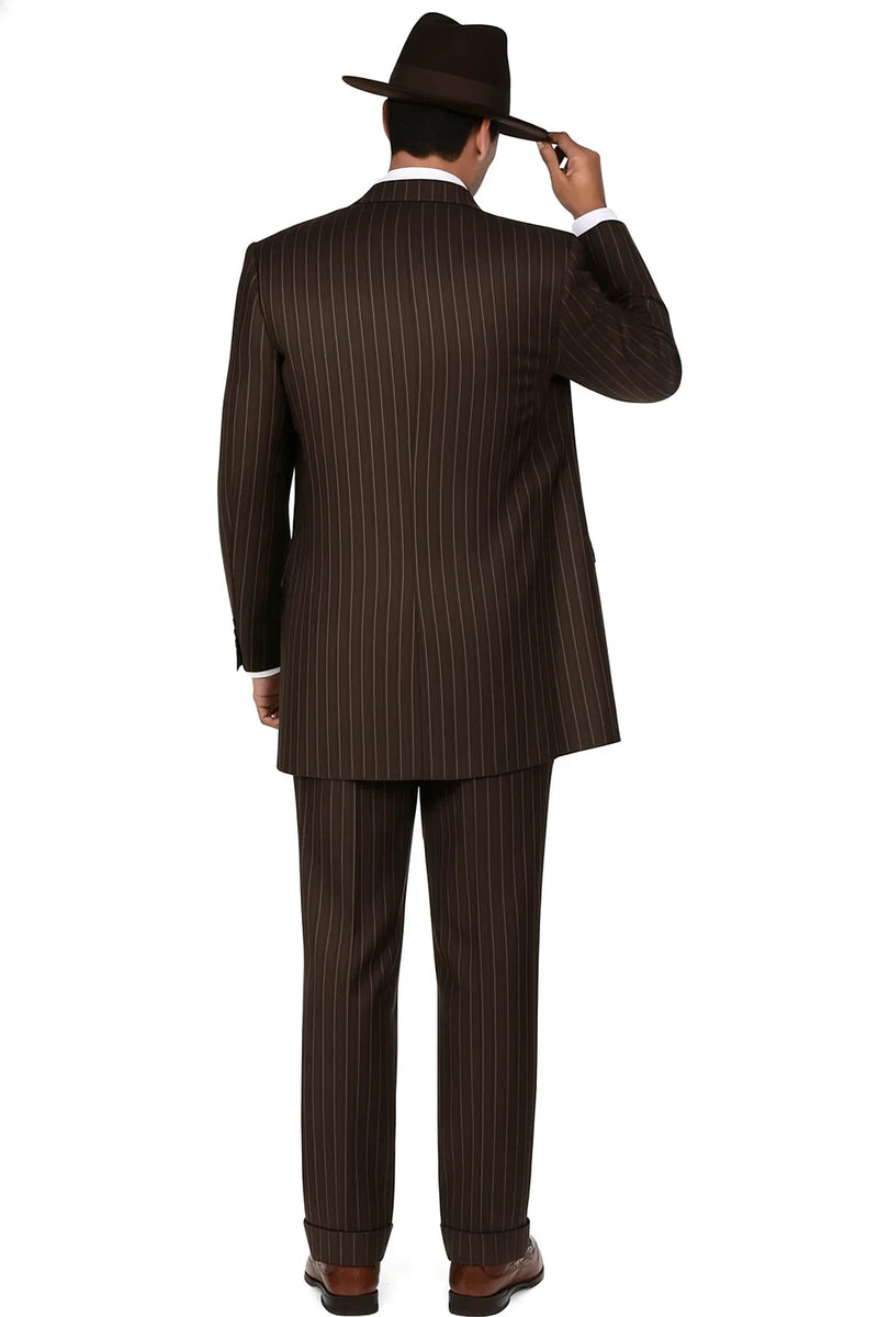 Men's dark brown pinstripe 3-piece suit. Fitted, structured silhouette with a long, single-breasted jacket, matching tapered trousers, and a vent. Includes a white shirt & brown hat.