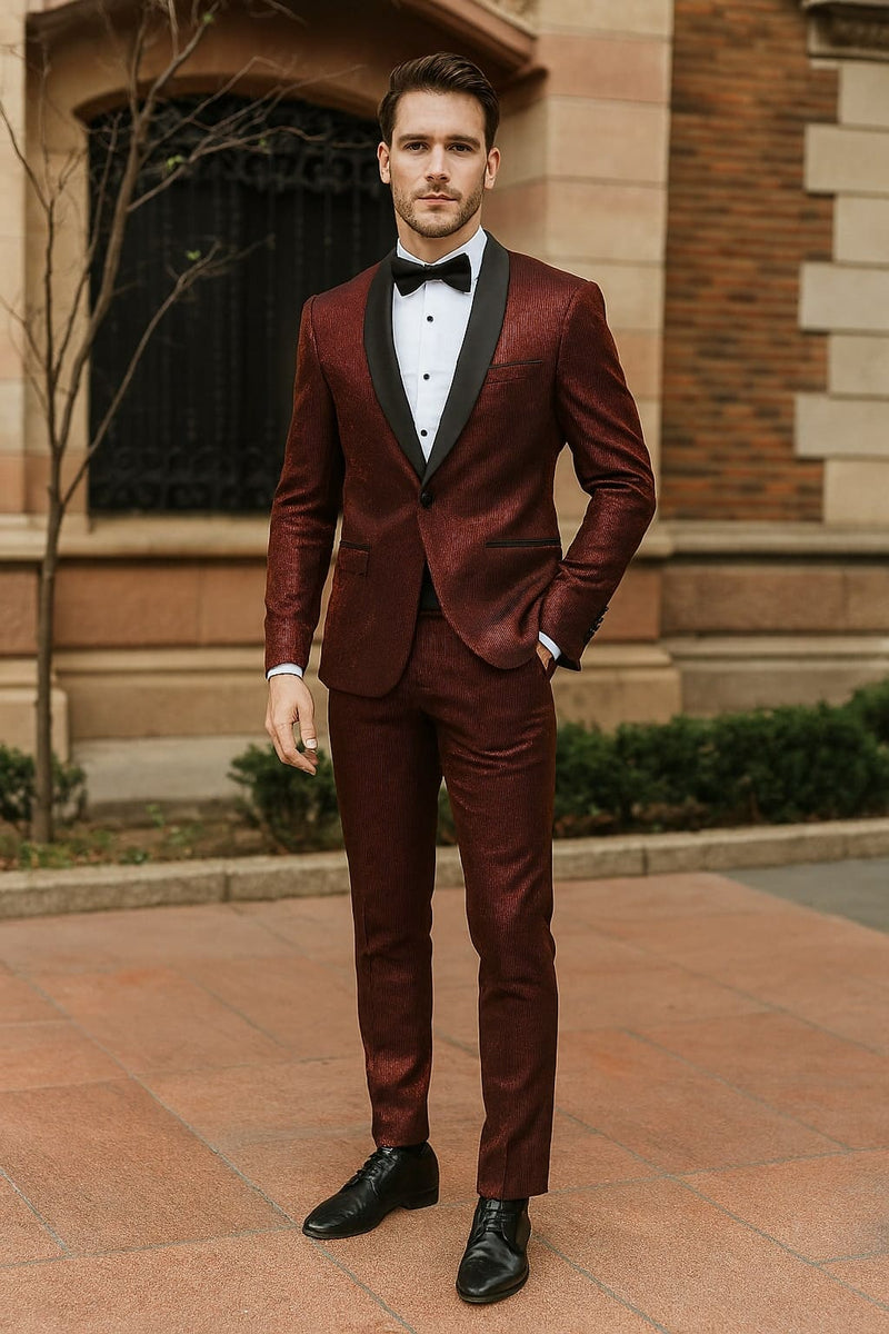 Burgundy shiny stripe tuxedo jacket by Alberto Nardoni. Fitted silhouette, single-button closure, black satin notched lapels. Glossy finish with subtle vertical stripes. Features two front pockets and a smooth lining at cuffs.

