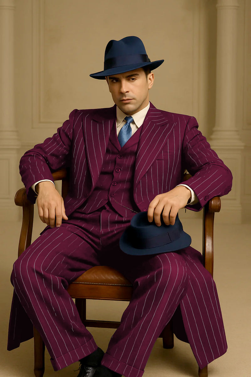 Men's burgundy pinstripe suit. Classic long coat with white stripes, structured silhouette, long sleeves, and lapel collar. Tailored textured fabric. Matching trousers.
