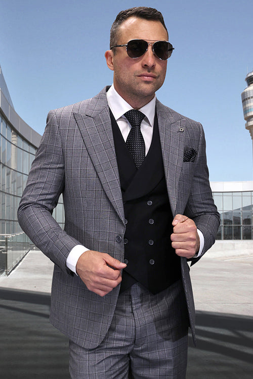 Men's black plaid wool suit with peak lapels. Includes a tailored jacket with structured shoulders, a black vest, matching trousers, white shirt, and polka dot tie. Two-toned gray pattern.
