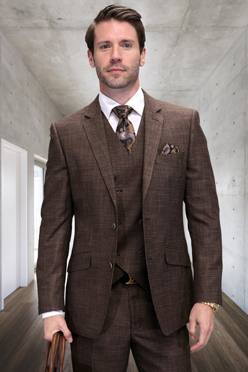 Men's modern fit brown sharkskin wool suit. Three-piece design: single-breasted jacket, vest, & trousers. Textured material, tailored silhouette. Includes patterned tie & pocket square. Classic & stylish.
