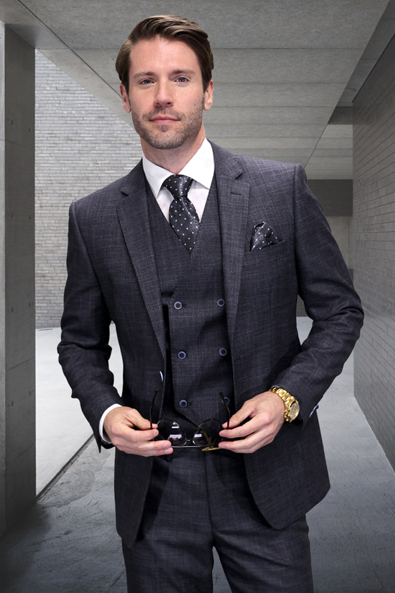 Charcoal grey sharkskin suit. Modern fit, wool blend. Features a peaked lapel, double-breasted vest, and tailored trousers. Subtle sheen and structured silhouette for a refined look.
