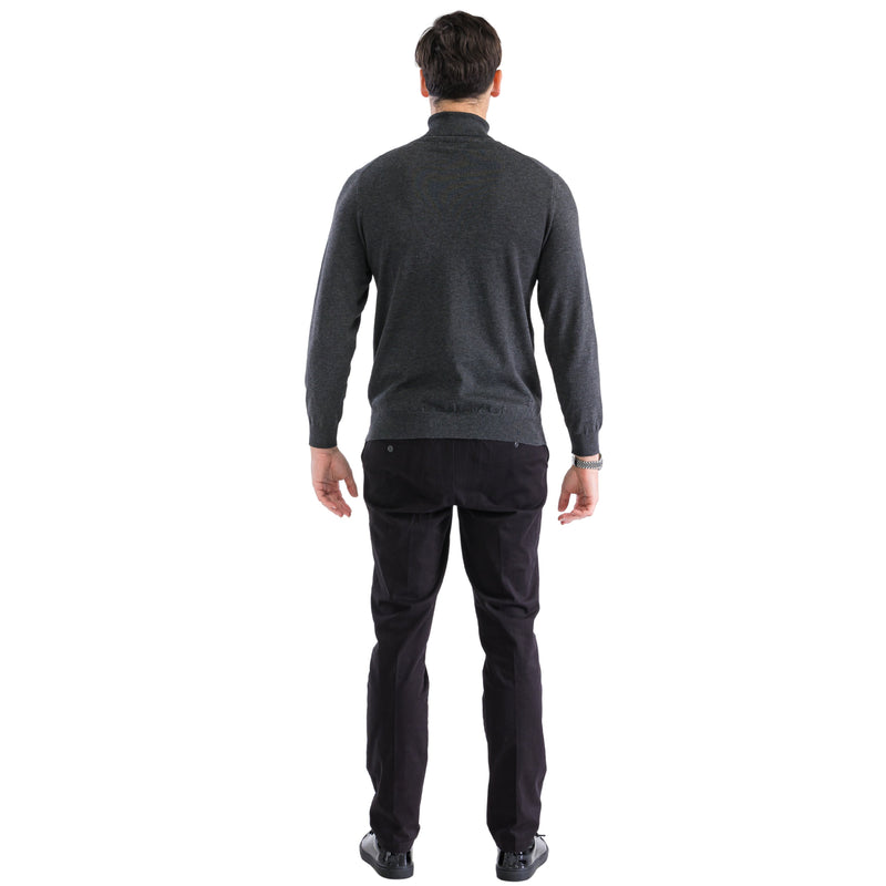 Men's charcoal gray turtleneck sweater. Fitted, long-sleeved, and high-necked. Knit fabric with ribbed hem/cuffs for structure. Solid charcoal color.
