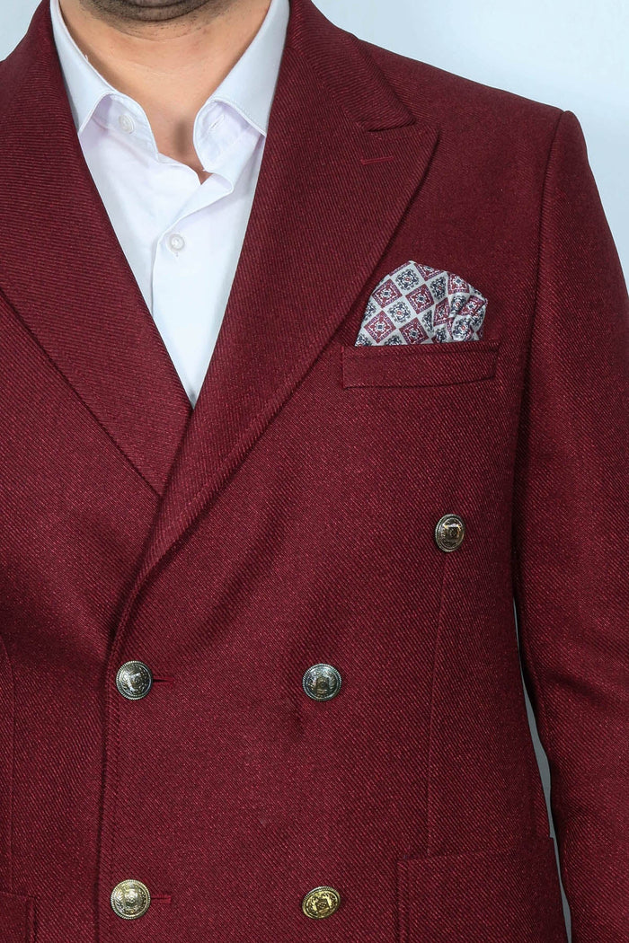 Men's burgundy slim fit blazer with textured fabric and double-breasted design. Gold buttons, breast pocket, and patterned pocket square. Sharp and stylish.
