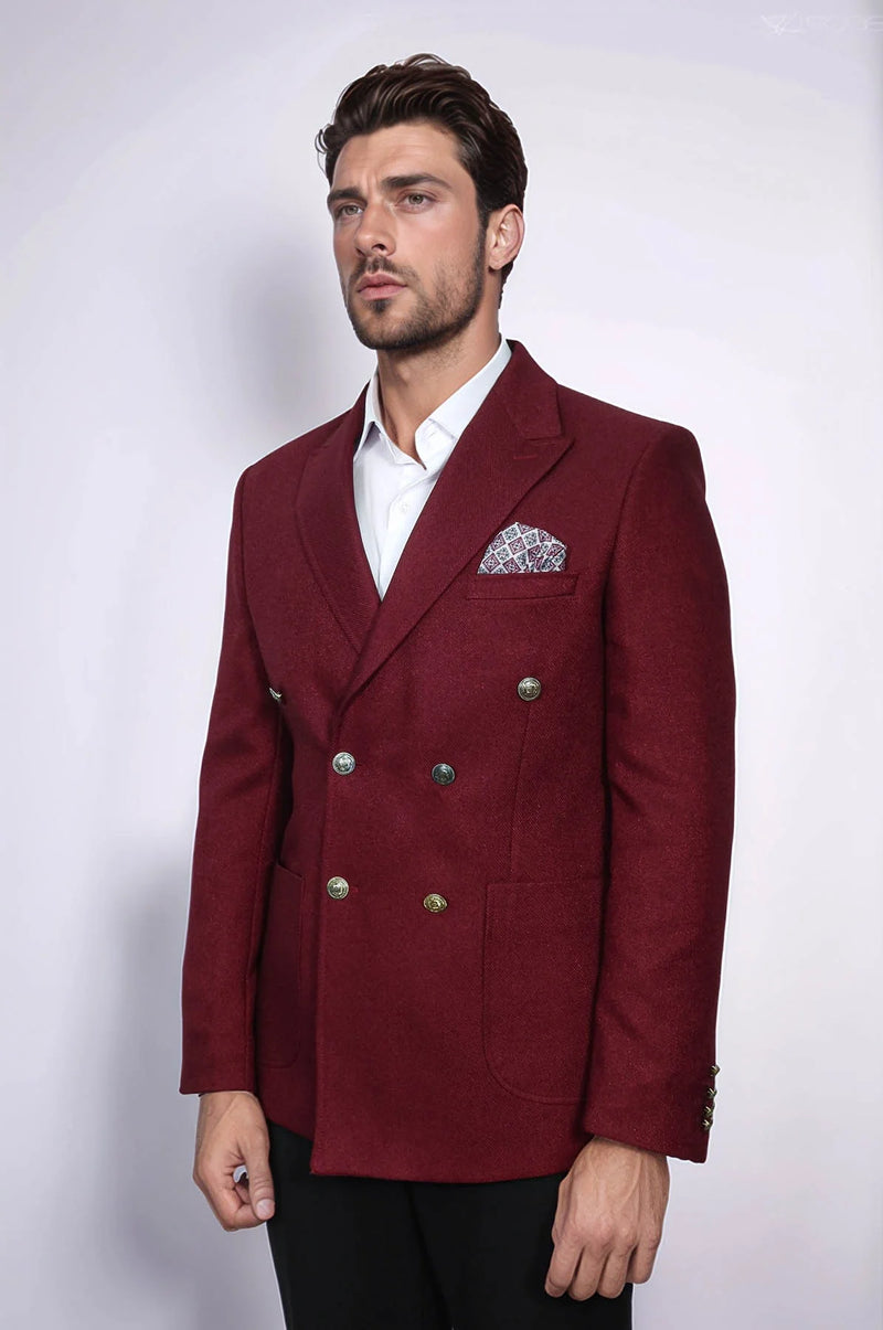 Burgundy slim-fit double-breasted blazer. Textured fabric, structured shape. Gold buttons on front and cuffs. Two visible pockets.
