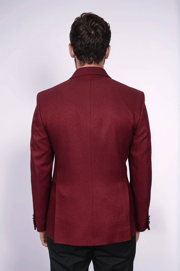 Burgundy blazer with a slim, double-breasted design. Textured fabric, structured silhouette, and standard lapels. Tailored fit with a clean back seam.

