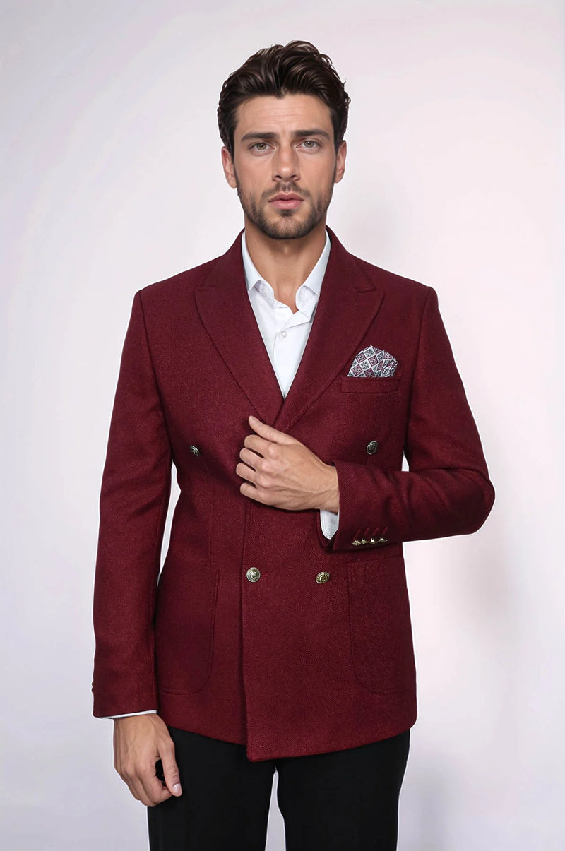 Men's burgundy slim-fit double-breasted blazer. Tailored silhouette, textured fabric, and brass buttons. Features a patterned handkerchief in the breast pocket.
