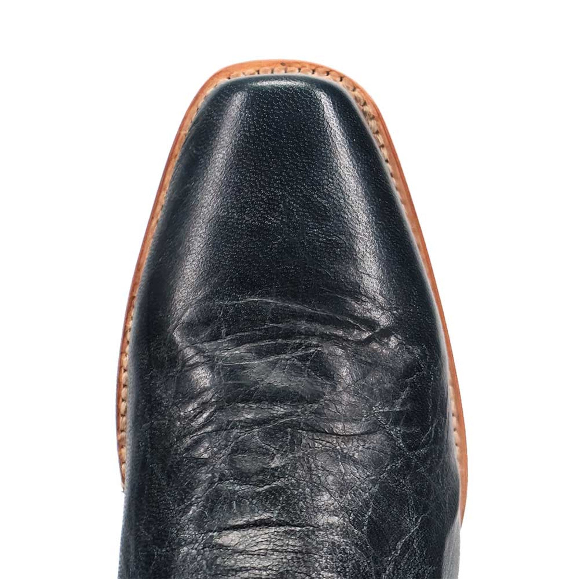 Dan Post men's Calvin boot. Black leather with a pointed toe and smooth finish. Features natural textures and a contrasting, stitched light-colored sole.
