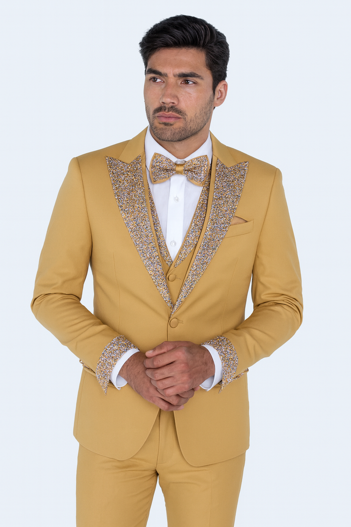 Men's champagne gold 4-piece tuxedo suit, ideal for prom or weddings. Includes jacket with decorative lapels, matching bow tie, and embellished trousers. Solid-colored material.