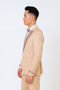 Men's champagne rose gold prom tuxedo: tailored fit, shimmering rose gold lapel & cuffs. Paired with white shirt and matching bowtie. Sophisticated & stylish.
