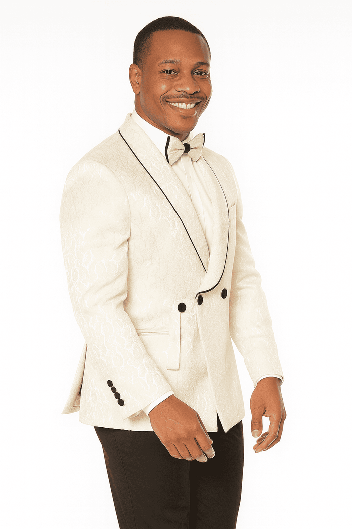 Men's champagne wedding tuxedo. Three-piece design with paisley pattern. Cream jacket, textured surface, black piping, double buttons. Classic and elegant.
