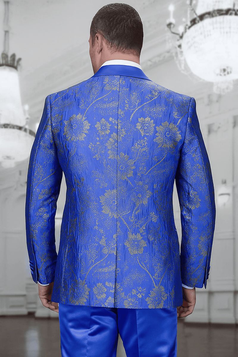 Royal blue tuxedo for men with paisley lace print. Structured jacket, double-breasted vest, and gold floral embellishments. A sophisticated formal look.
