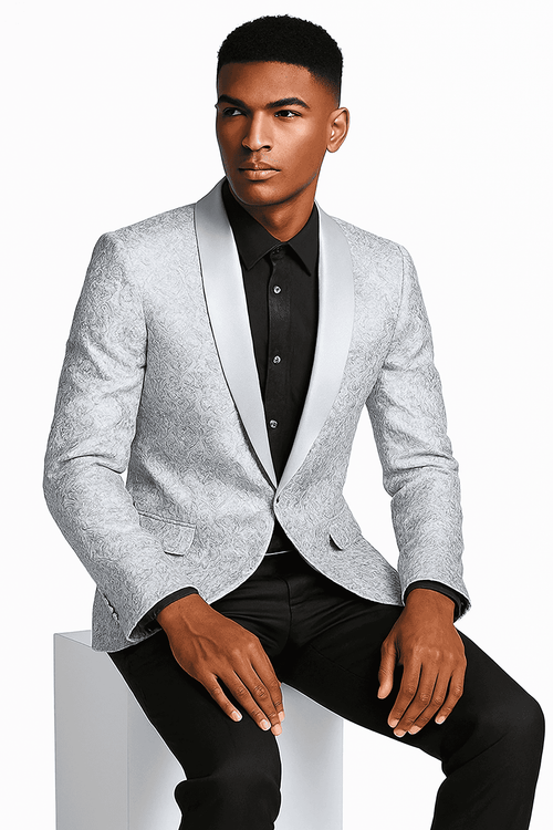 Men's silver-grey tuxedo jacket with tonal paisley. Structured silhouette, satin peak lapel, front pockets. Intricate paisley pattern throughout.
