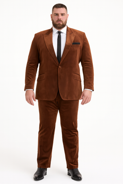 Men's brown velvet two-piece suit. Rust copper color, slim fit. Formal blazer with structured shape, single button, two pockets. Tailored pants. Plush, soft velvet. Includes black pocket square. Refined look.
