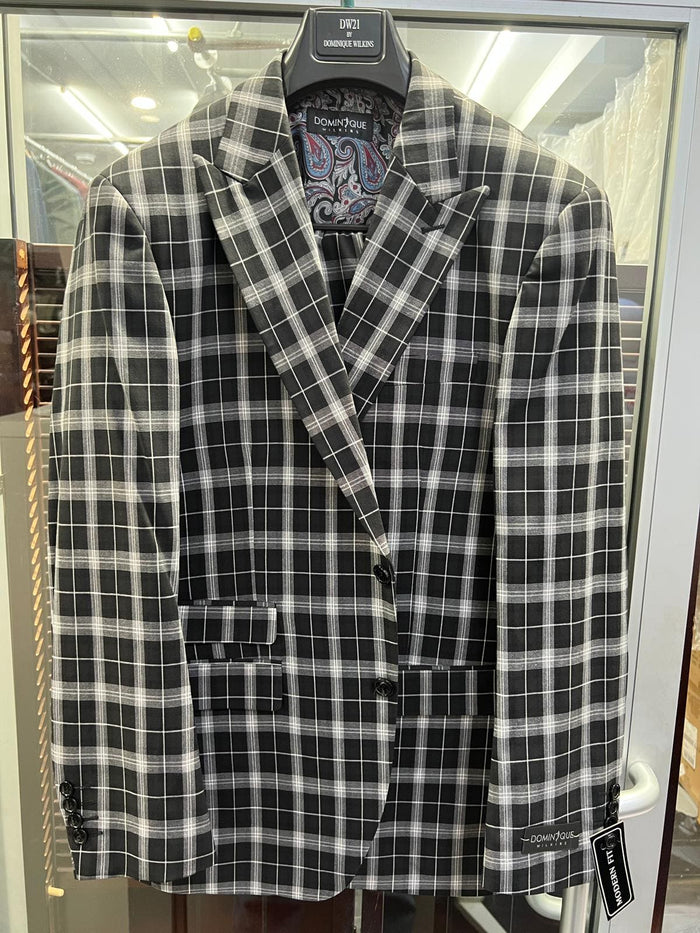 Men's black & white plaid blazer. Structured shape, notched lapel, front pockets, 3-button closure. Bold plaid pattern. Paisley lining. Black cuff buttons.