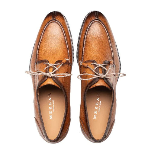 Mezlan's Fratello cognac deerskin lace-up shoes. Split-toe design with a rounded shape, crafted from smooth cognac deerskin. Minimalist lace-up system, light interior lining, and a dark outsole.
