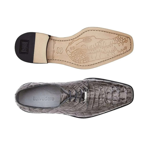 Gray crocodile hornback oxfords by Belvedere Chapo. Pointed toe, laced closure, and black outsole. Interior features a crocodile graphic. Exotic and stylish design.
