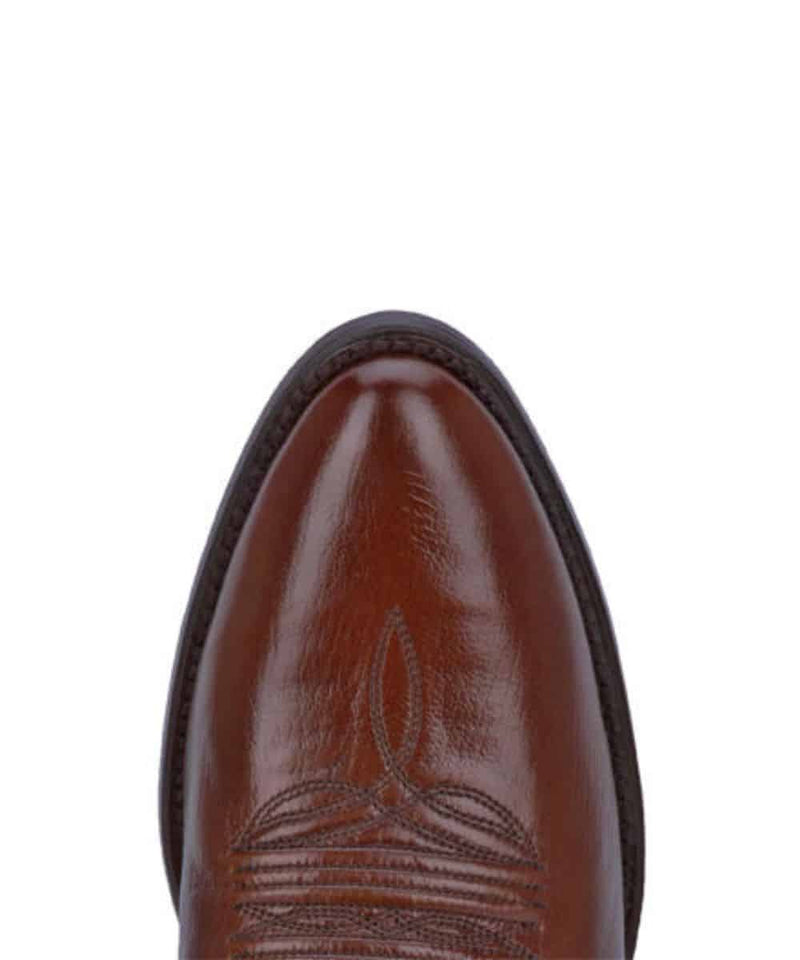 Dan Post Men's Milwaukee boot: Brown leather, pointed toe, decorative shaft stitching. Structured silhouette with subtle sole edge. Polished finish.
