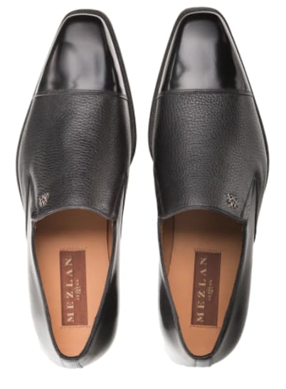 Milani slip-ons: black calfskin toe & deerskin body. Glossy toe, textured leather, pointed shape, slip-on. Slight heel.
