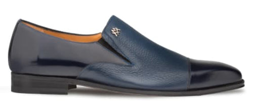 Milani slip-ons: Navy blue calfskin & deerskin. Streamlined silhouette with glossy/textured upper, stitched cap toe. Metallic logo. Low heel, slightly pointed toe for a sleek look.

