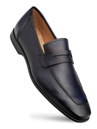 Men's blue deerskin penny loafers with elongated shape and raised front. Elastic band overlay, textured surface, and rich grain pattern. Deep blue with light inner lining, black sole.
