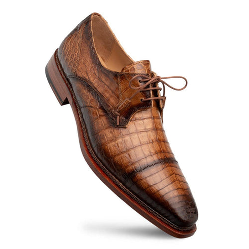Men's Giovane Fuscus derby shoes in camel crocodile. Pointed toe, textured scale pattern, flat lacing, and a slightly raised heel. Sole appears solid wood.
