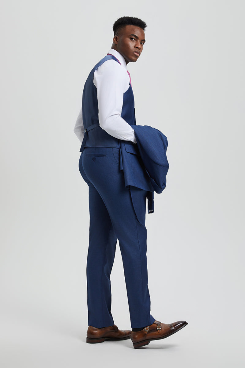 Men's Stacy Adams sharkskin suit: solid blue, two-button, vested. Fitted vest with back design, straight-leg trousers. Subtle sheen fabric. Includes white shirt & brown shoes.
