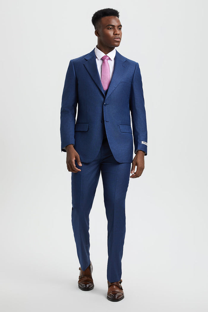 Stacy Adams two-button vested suit: Blue sharkskin. Tailored fit with blazer, trousers & vest. Features notch lapel, 2 pockets, & straight-leg trousers. Smooth surface with subtle sheen.