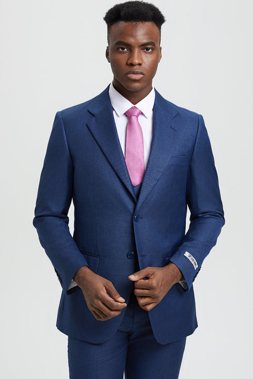 Stacy Adams men's blue sharkskin suit. Two-button, single-breasted jacket with notch lapels, fitted silhouette. Includes a vest. Subtle sheen characteristic of sharkskin fabric.
