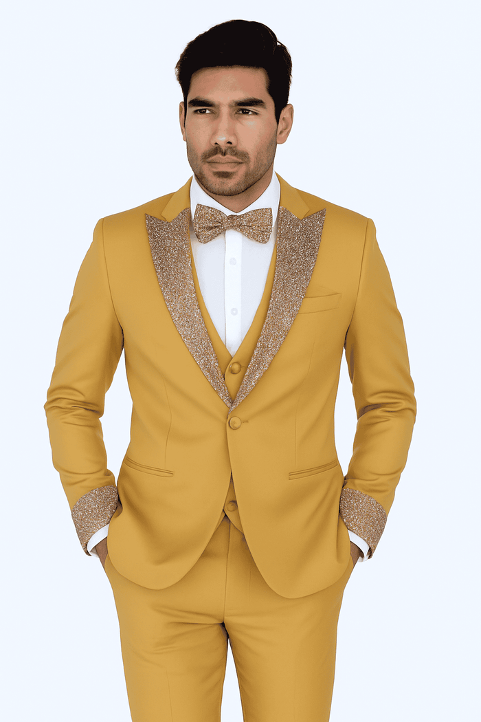 Champagne gold 4-piece tuxedo: fitted jacket with textured, glittering lapels, matching vest, white shirt, and bow tie.