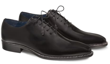 Mezlan's Enterprise balmoral: sleek black calfskin. Elongated shape, smooth, shiny leather. Lace-up with six eyelets, stitched welt. Pointed toe, low stacked heel. Blue lining.
