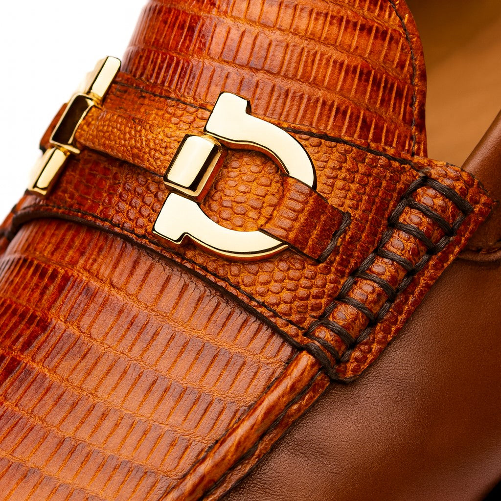 Marco Di Milano Enzo loafers: cognac lizard skin upper, gold-tone bit, structured silhouette. Luxurious and textured with smooth leather accents.
