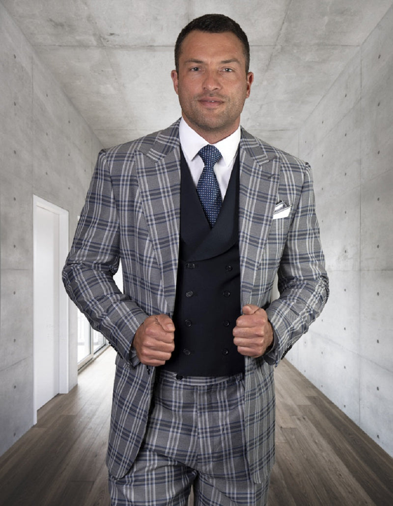 Navy men's classic fit suit with peak lapels, featuring a double-breasted vest. Structured, tailored silhouette in textured navy fabric. No patterns, classic style.
