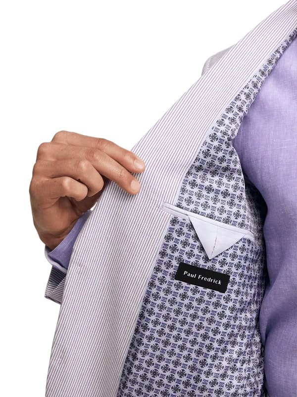 Lavender seersucker blazer for men. Vertical striped light lavender exterior. Cotton fabric. Patterned interior with dark floral designs on white. Features a breast pocket. Lightweight.
