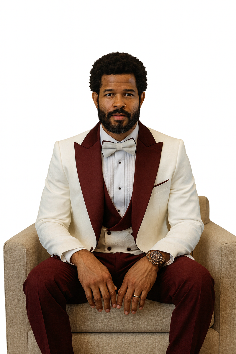 Hilton's white paisley peak lapel tuxedo jacket, burgundy shawl vest, and burgundy wool pants. A bow tie completes the look.
