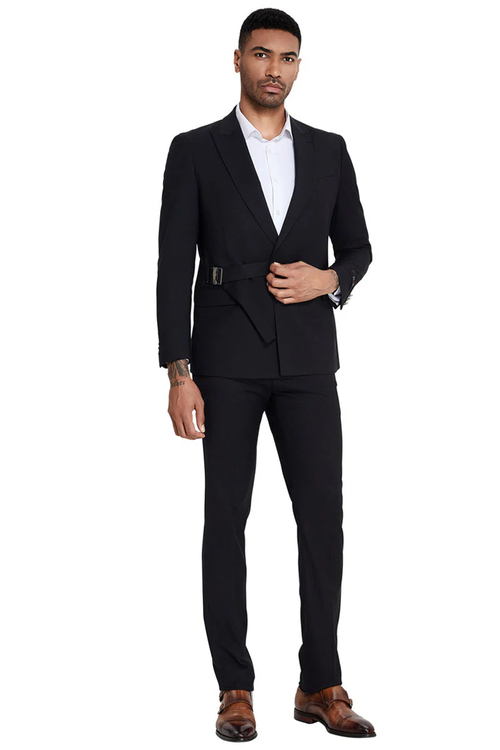 Black men's slim-fit suit. French front, peak lapel jacket with waist belt. Slim trousers. Smooth, uniform fabric.
