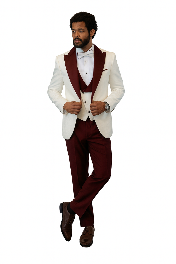 White tuxedo jacket with burgundy peak lapel, matching vest and wool pants. Finished with a burgundy bow tie for a sophisticated look.
