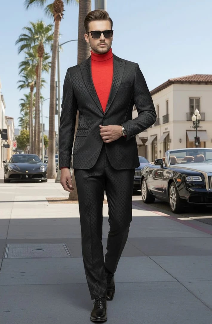 Alberto Nardoni men's slim-fit, one-button suit in black. Peak lapel jacket with a subtle textured pattern. Matching tailored pants create a sleek, cohesive look. Made with smooth fabric.
