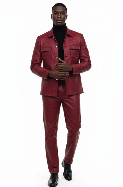 Burgundy faux leather slim-fit two-piece suit. Buttoned jacket with two front pockets. Matching slim-fit trousers. Modern and stylish design.
