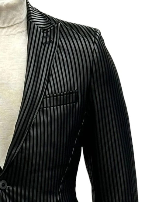 Men's black suit with pinstripes. One-button, peak lapel, side vent. Features a chest pocket. Classic design.
